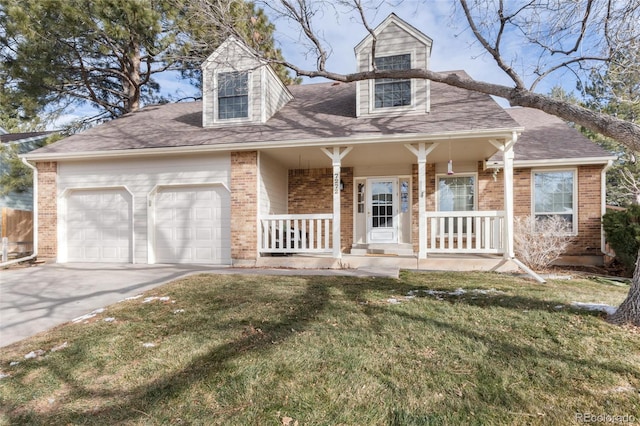 cape cod-style house with a front yard, a garage, and covered porch