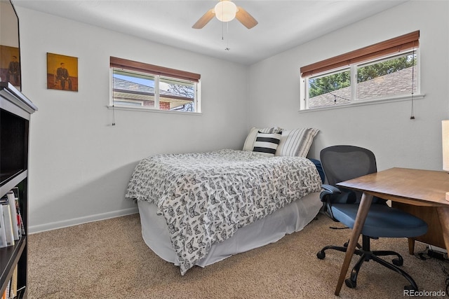 bedroom with carpet flooring, a ceiling fan, and baseboards