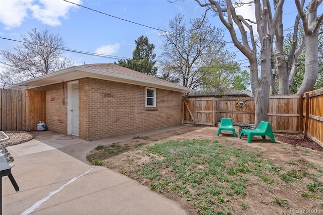 exterior space with a fenced backyard