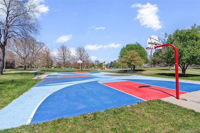 view of basketball court with a lawn and community basketball court