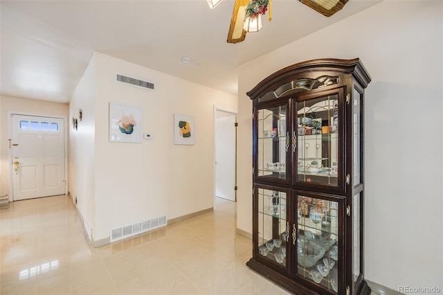 corridor with light tile patterned flooring