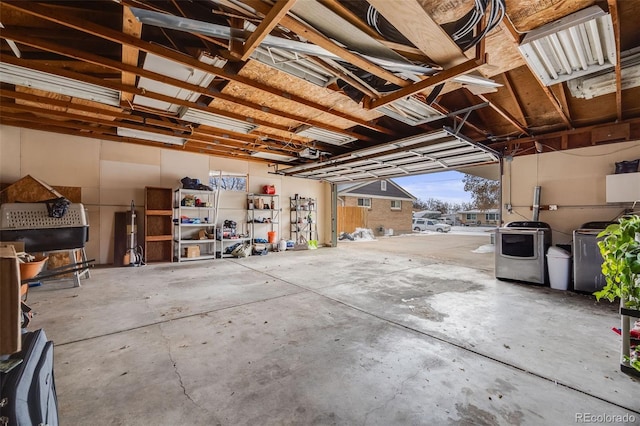 garage featuring washing machine and dryer