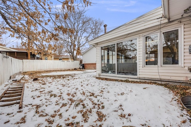 view of yard covered in snow