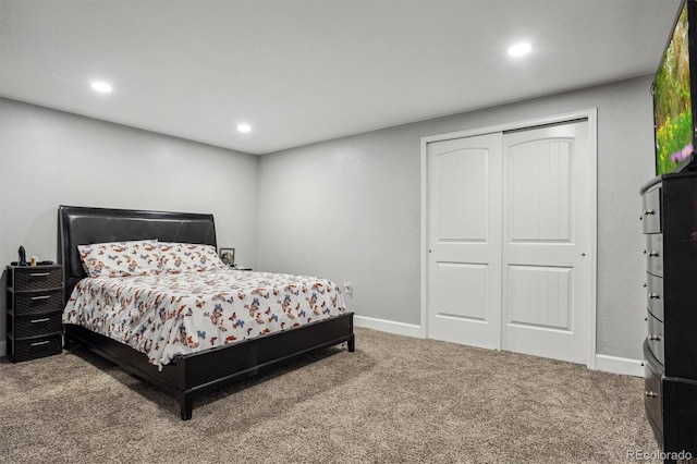 carpeted bedroom featuring a closet