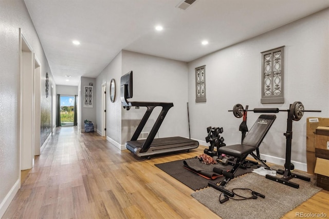 exercise area featuring light wood-type flooring