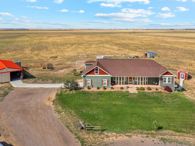 birds eye view of property with a rural view