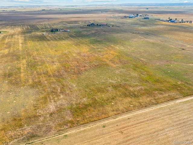 birds eye view of property featuring a rural view