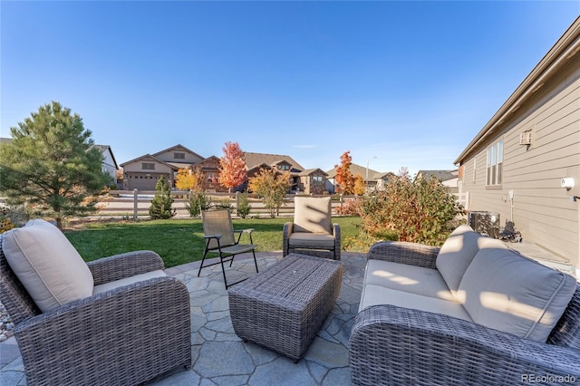 view of patio / terrace with a residential view, outdoor lounge area, and fence