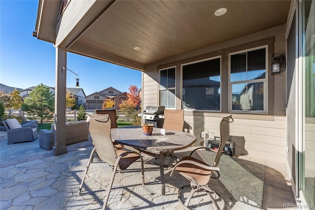 view of patio / terrace featuring outdoor dining area and a grill