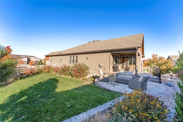 back of house featuring a patio area, a lawn, fence, and an outdoor hangout area