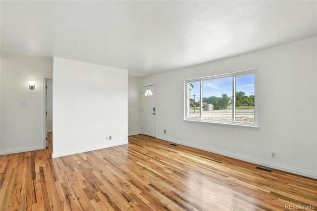 2441 E 93rd Pl, Thornton, CO 80229 - unfurnished living room featuring light wood-type flooring and baseboards