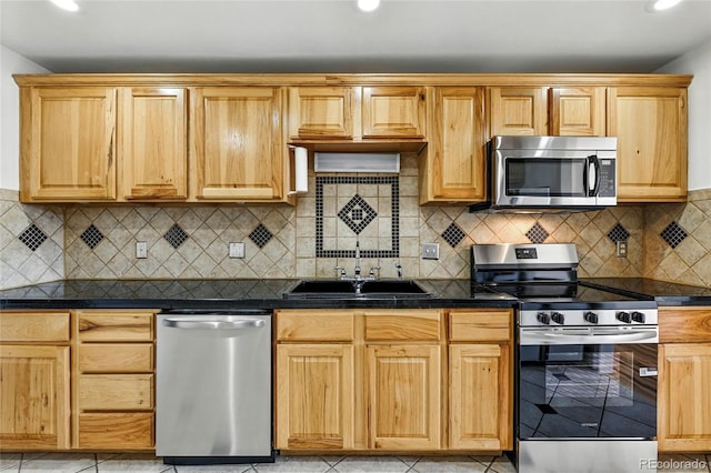 2441 E 93rd Pl, Thornton, CO 80229 - kitchen with appliances with stainless steel finishes, dark countertops, recessed lighting, and decorative backsplash