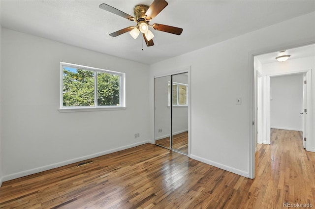 2441 E 93rd Pl, Thornton, CO 80229 - unfurnished bedroom featuring light wood-style floors, a closet, and ceiling fan