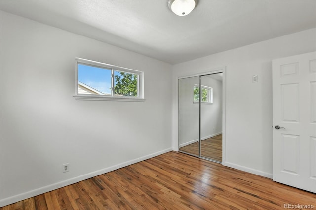 2441 E 93rd Pl, Thornton, CO 80229 - unfurnished bedroom featuring wood finished floors and a closet