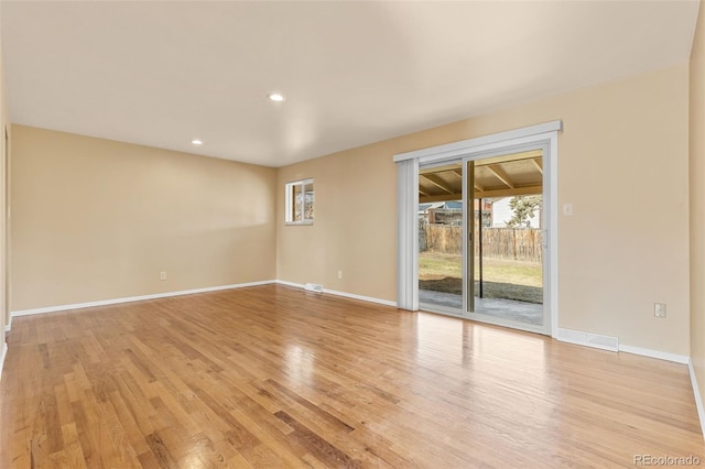 unfurnished room featuring recessed lighting, visible vents, baseboards, and light wood finished floors