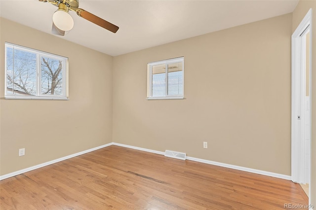 unfurnished bedroom featuring visible vents, baseboards, light wood-style floors, and ceiling fan