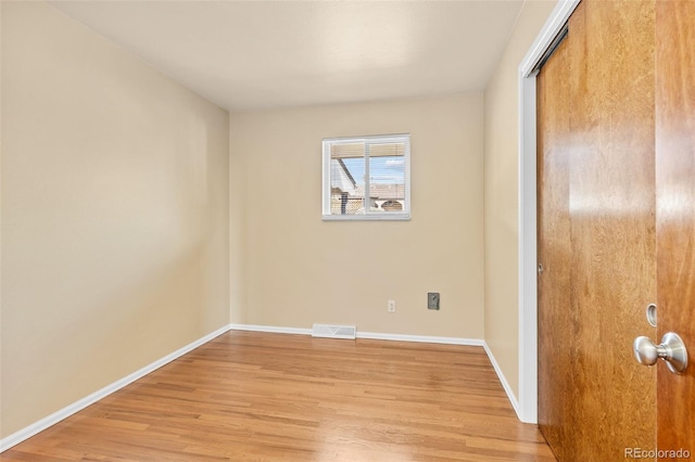 unfurnished bedroom with visible vents, baseboards, a closet, and light wood finished floors