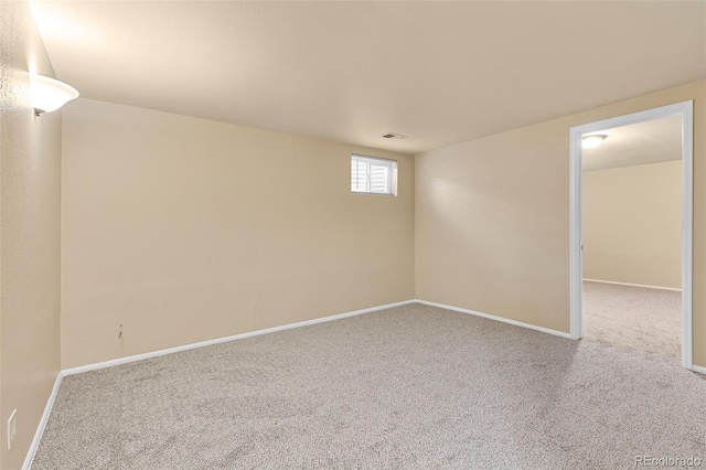 basement featuring carpet and baseboards