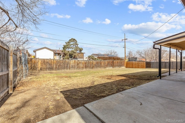 view of yard with a patio and a fenced backyard