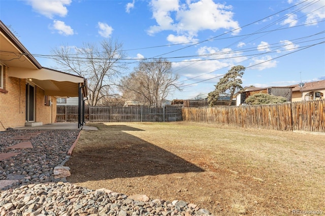 view of yard with a patio and a fenced backyard