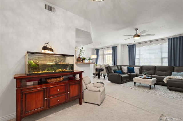 living room with ceiling fan and light carpet