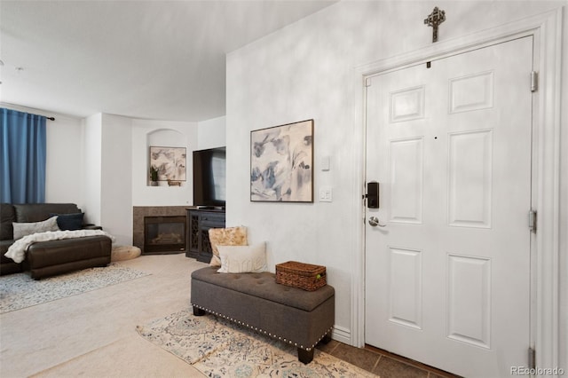 foyer entrance with a fireplace