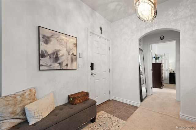 hallway with tile patterned flooring