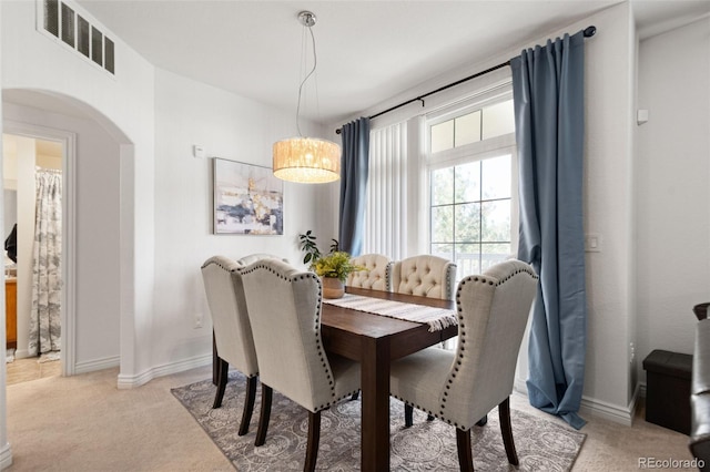 dining area with light carpet