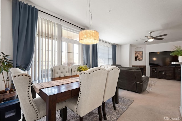 dining room featuring light colored carpet and ceiling fan