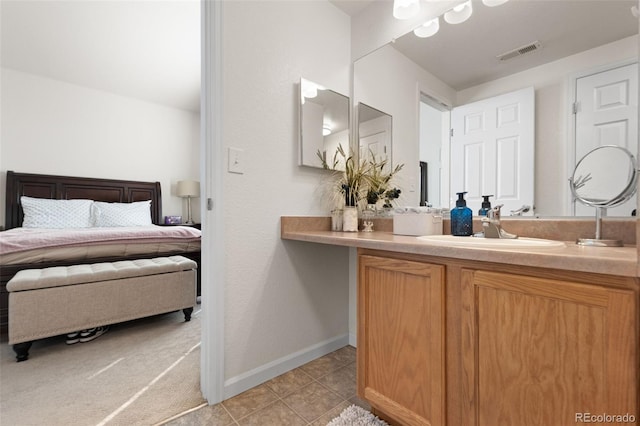 bathroom featuring tile patterned floors and vanity