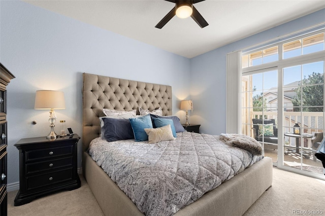 carpeted bedroom featuring access to exterior and ceiling fan