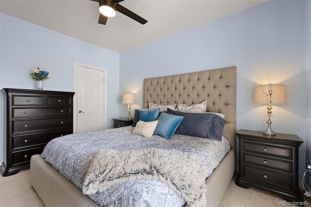 bedroom with ceiling fan and light colored carpet