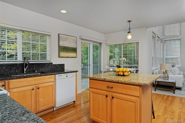 2500 Lexington St, Lafayette, CO 80026 - kitchen with white dishwasher, a sink, light wood-type flooring, and dark stone counters
