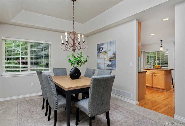 2500 Lexington St, Lafayette, CO 80026 - dining area with a chandelier, light colored carpet, baseboards, recessed lighting, and a raised ceiling