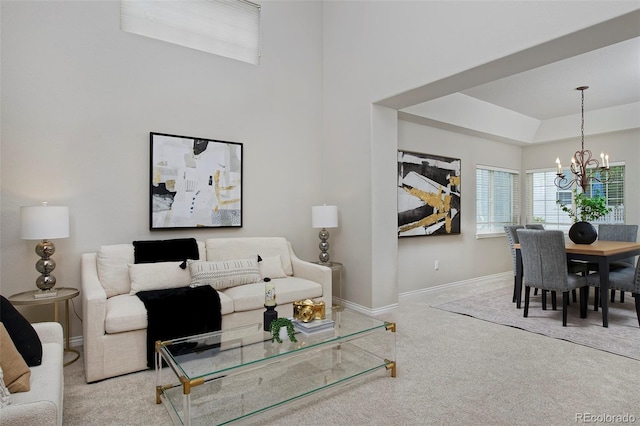 2500 Lexington St, Lafayette, CO 80026 - living area featuring a chandelier, carpet flooring, baseboards, and a tray ceiling