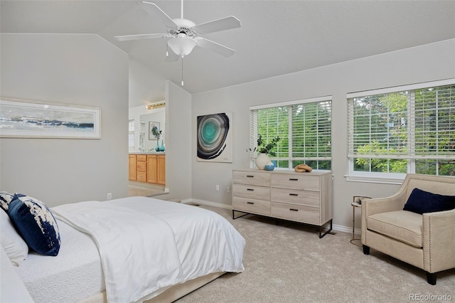 2500 Lexington St, Lafayette, CO 80026 - bedroom with lofted ceiling, light carpet, baseboards, a ceiling fan, and connected bathroom
