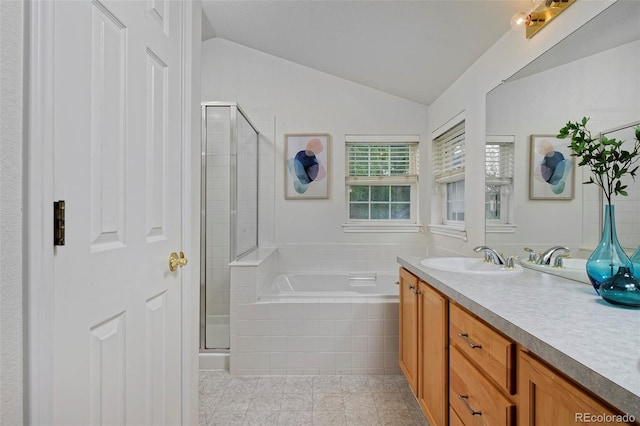 2500 Lexington St, Lafayette, CO 80026 - full bath with a stall shower, vanity, a bath, tile patterned floors, and vaulted ceiling