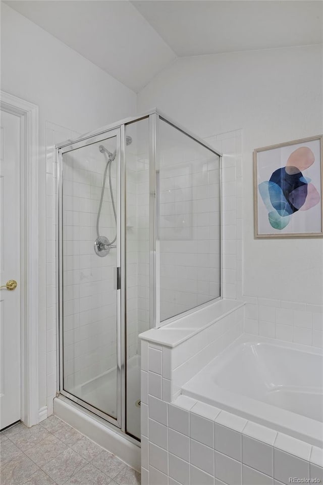 2500 Lexington St, Lafayette, CO 80026 - bathroom featuring a stall shower, a garden tub, and lofted ceiling