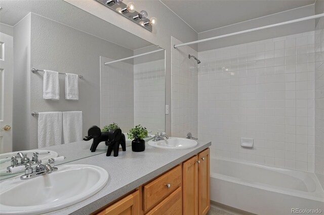 2500 Lexington St, Lafayette, CO 80026 - bathroom featuring washtub / shower combination and double vanity