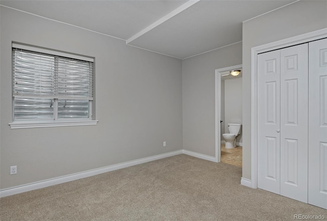 2500 Lexington St, Lafayette, CO 80026 - unfurnished bedroom with carpet flooring, a closet, baseboards, and ensuite bathroom