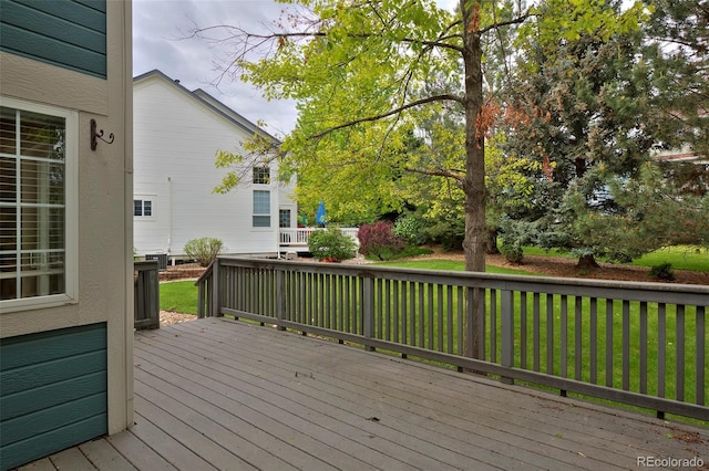2500 Lexington St, Lafayette, CO 80026 - wooden deck featuring a lawn