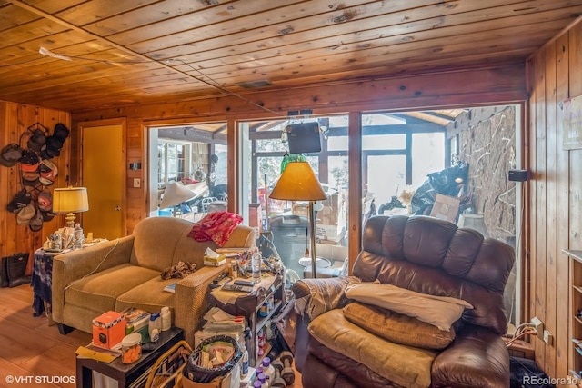 living room with wood-type flooring, wooden walls, and wood ceiling