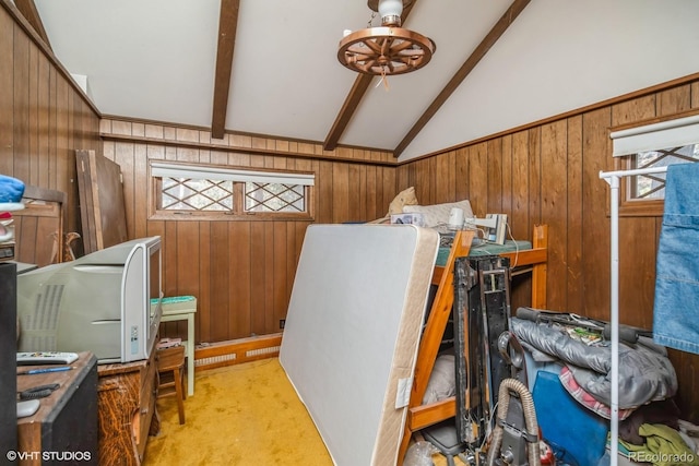 misc room with light carpet, wooden walls, and lofted ceiling with beams