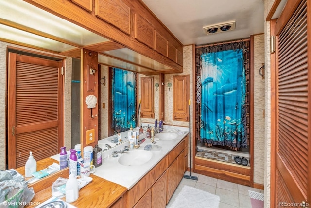 bathroom with tile patterned floors and vanity