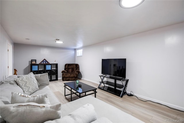 living room with wood finished floors and baseboards