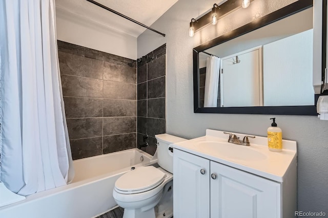 bathroom with toilet, a textured wall, shower / tub combo with curtain, and vanity