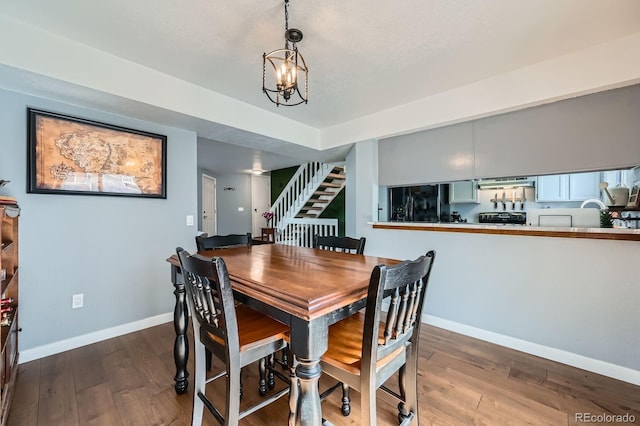 68 S Moline St, Aurora, CO 80012 - dining space with stairway, baseboards, hardwood / wood-style floors, and a chandelier
