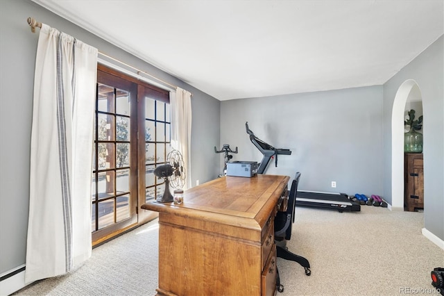 office area with light carpet and baseboard heating