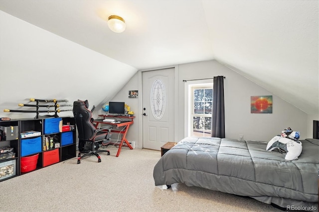 carpeted bedroom featuring lofted ceiling