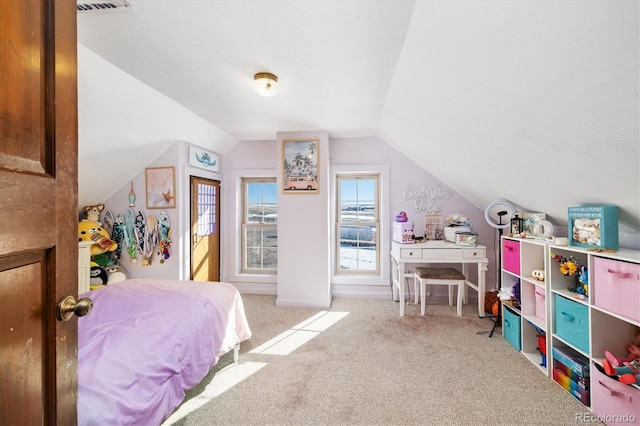 carpeted bedroom with vaulted ceiling